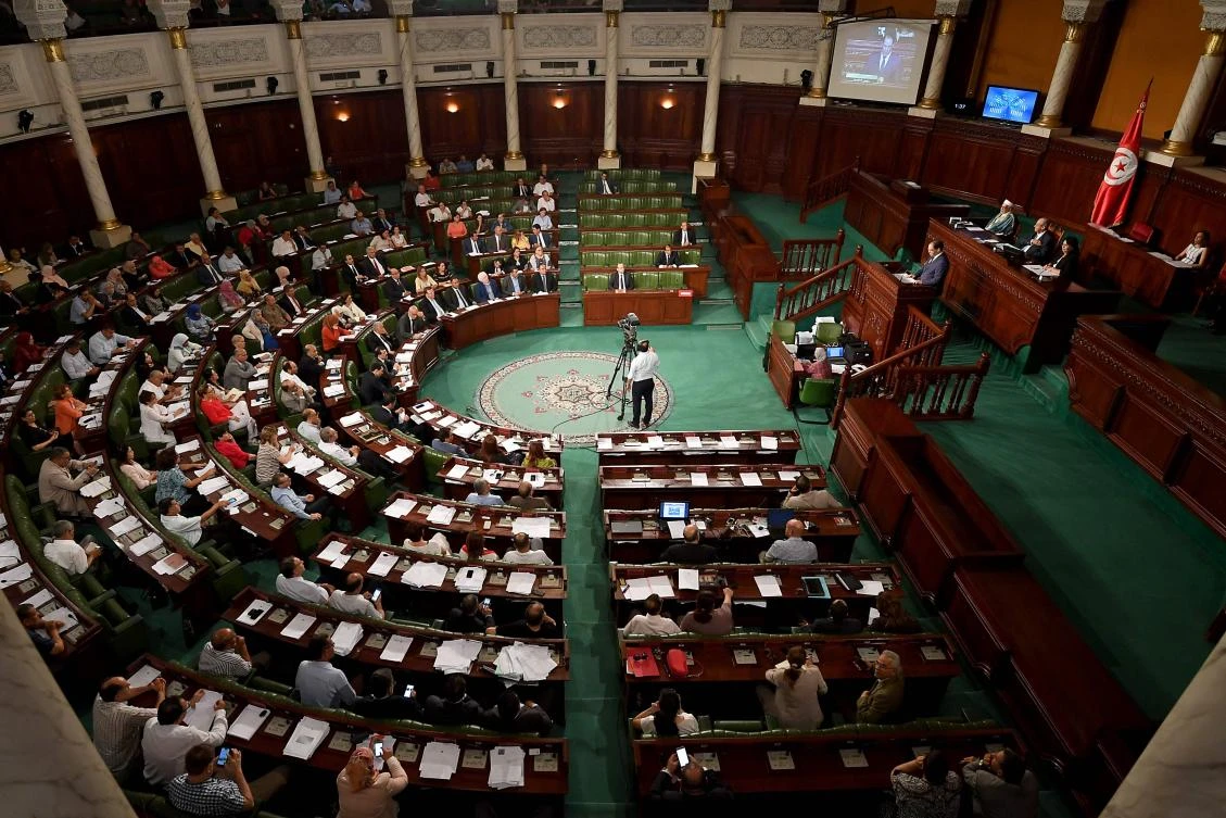 Tunisian Prime Minister Youssef Chahed told the country's parliament he is allowing 40 migrants who have been kept at sea for two weeks to enter Tunisia. (AFP / FETHI BELAID)