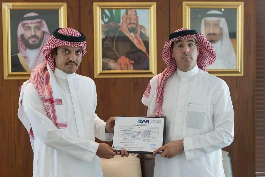 Saudi Minister of Information, Awwad bin Saleh Al-Awad (R), handed over the third cinema operation license to the Al-Rashed United Group — Empire Cinema. (SPA)