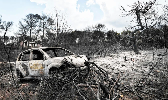 Death toll from Greek wildfire reaches 91 as village grieves