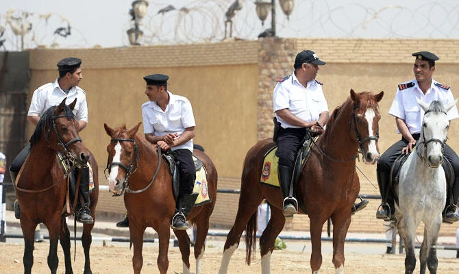 Egyptian mounted security stand guard outside the police academy in Cairo, in this file photo taken on April 21, 2015. (AFP)