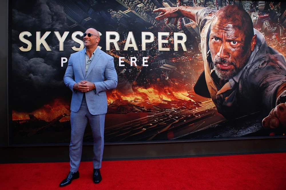 Skyscraper sucks Dwayne Johnson into a see-saw battle