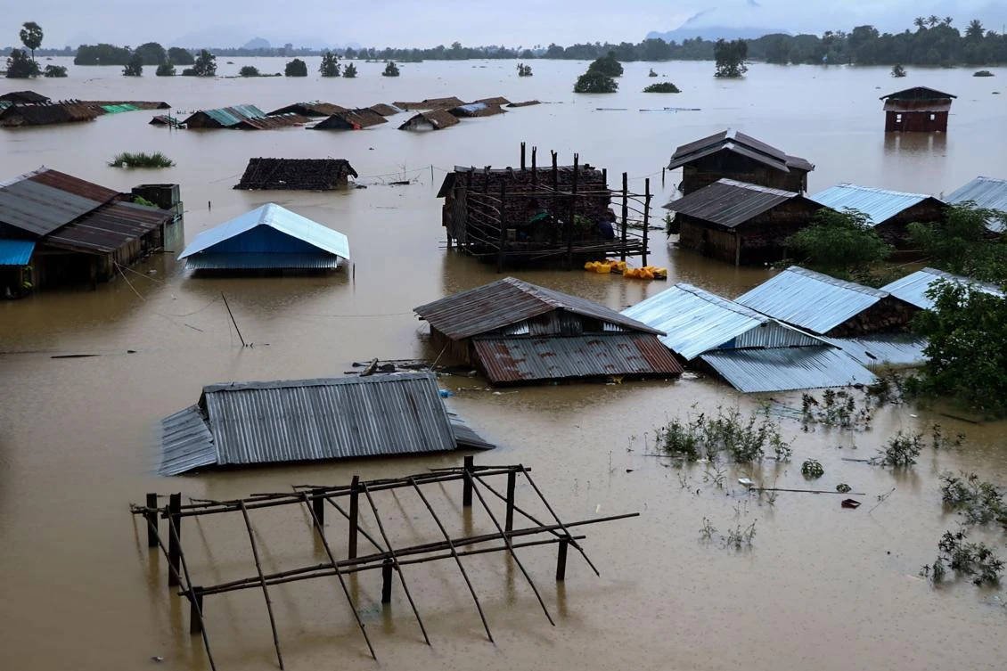 Floodwaters have forced thousands from their homes in southeast Myanmar, local police said on July 27, as authorities and volunteers scrambled to provide food and aid to the victims. (Saw Kyaw San Oo/AFP)