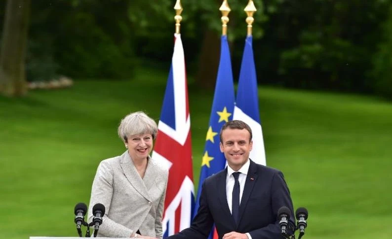 Britain's Prime Minister Theresa May (L) and France's President Emmanuel Macron meet at The Elysee Palace in Paris in this file photo from June 13, 2017. (AFP)