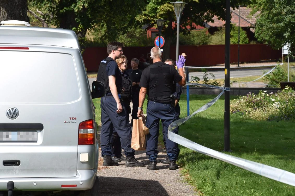 Police stand next to a cordoned zone on July 31, 2018 as they investigate after Sweden’s royal jewels dated from the 17th century have been stolen in the Strängnäs cathedral, west of Stockholm. (AFP)