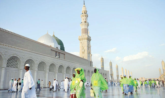 Pilgrims walking through the courtyard at the Prophet's mosque in Madinah. (SPA)