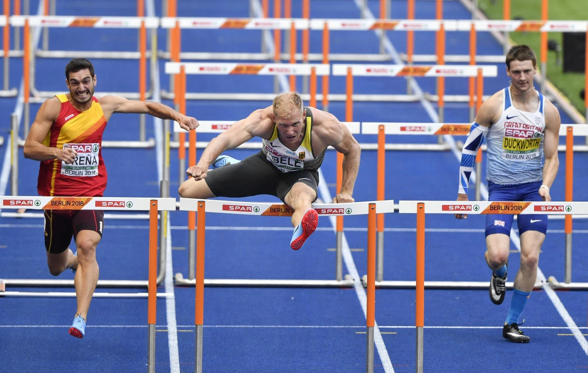 Spain's Jorge Urena, Germany's Arthur Abele and Britain's Tim Duckworth, from left, compete in the 110-meters hurdles of the decathlon at the European Athletics Championships in Berlin, Germany, Wednesday, Aug. 8, 2018. (AP Photo/Martin Meissner)