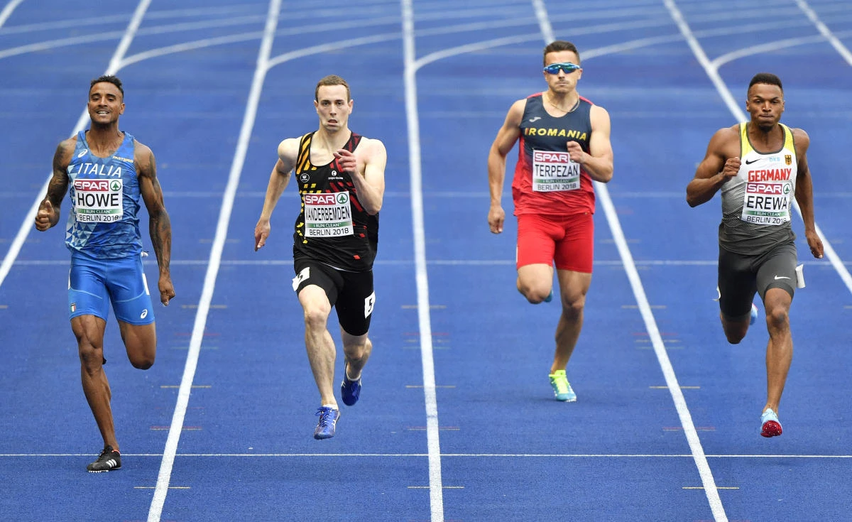 Italy's Andrew Howe, Belgium's Robin Vanderbemden, Romania's Alexandru Terpezan and Germany's Robin Erewa, from left, compete in a men's 200-meter heat at the European Athletics Championships in Berlin, Germany, Wednesday, Aug. 8, 2018. (AP Photo/Martin Meissner)