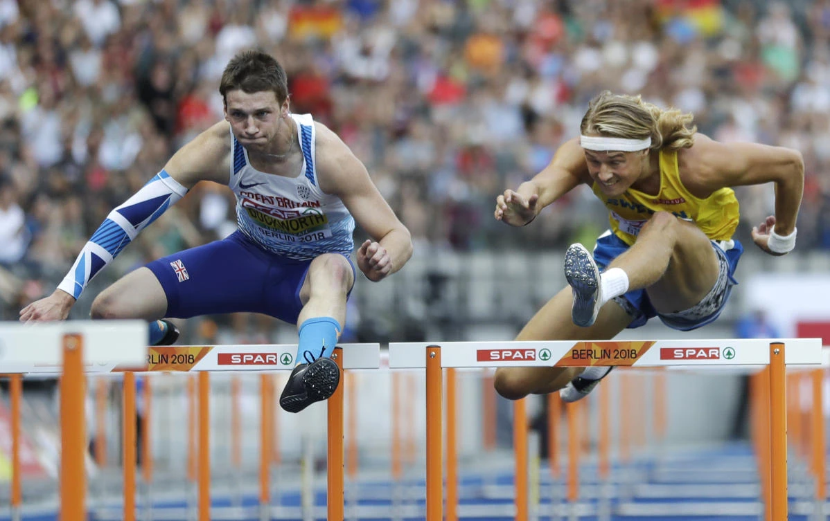 Britain's Tim Duckworth, left, and Sweden's Fredrik Samuelsson compete in the 110-meter hurdles of the decathlon at the European Athletics Championships at the Olympic stadium in Berlin, Germany, Wednesday, Aug. 8, 2018. (AP Photo/Matthias Schrader)