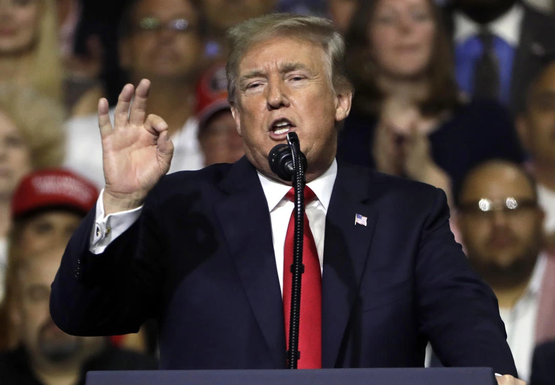 President Donald Trump gestures during a rally Tuesday, July 31, 2018, in Tampa, Florida (File photo: Chris O’Meara/AP)