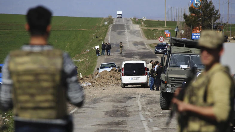 Members of Turkish forces secure the scene of an explosion on the road linking the cities of Diyarbakir and Bingol, in southeastern Turkey. (File photo: AP)