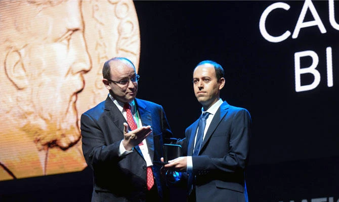 Kurdish mathematician, Cauchar Birkar (R), 40, receives the Fields Medal Award, math's most prestigious prize, during the International Congress of Mathematicians (ICM 2018) in Rio de Janeiro, Brazil, on Wednesday, August 01, 2018. (AFP)