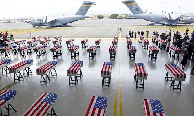 Flag draped transfer cases with the remains of American soldiers repatriated from North Korea are seen during a repatriation ceremony after arriving to Joint Base Pearl Harbor-Hickam, Honolulu, Hawaii, on Wednesday, August 1, 2018. (AFP)