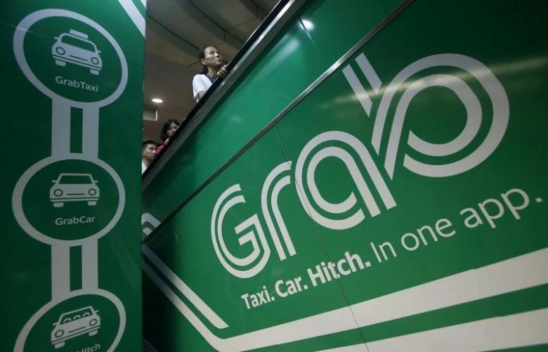 Grab, which started as a taxi-booking app, has been transforming itself into a consumer technology group. (Reuters)