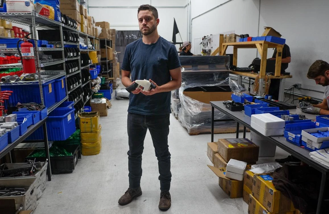 Cody Wilson, owner of Defense Distributed company, holds a 3D printed gun, called the Liberator, in his factory in Austin, Texas on Wednesday, August 1. (AFP)
