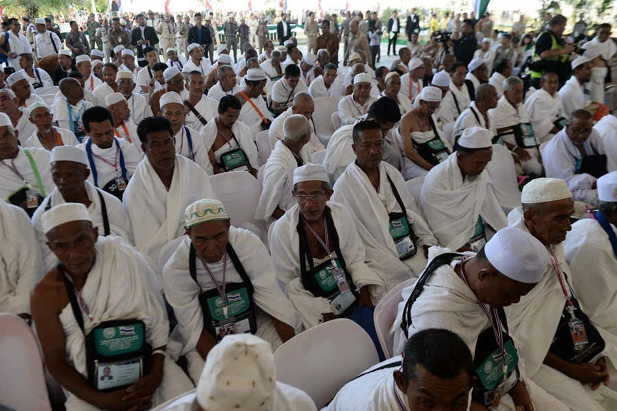 A large group of Thai Muslims wait to board a special flight for the annual Hajj pilgrimage to Makkah on July 24, 2018. (Madaree Tohlala/AFP)