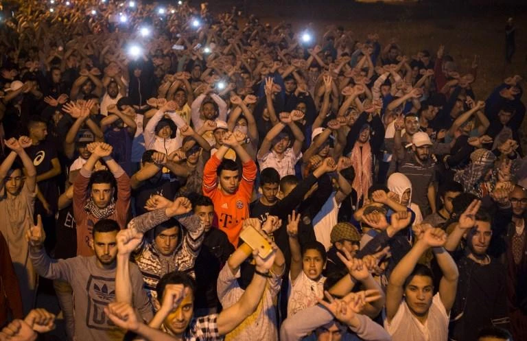In this file photo, protesters from the Rif movement 'Hirak' chant during a demonstration against corruption, repression and unemployment in the northern Moroccan town of Imzouren. (AFP)