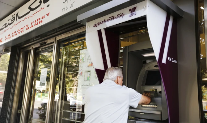 Iranians scramble to protect their savings amid looming sanctions