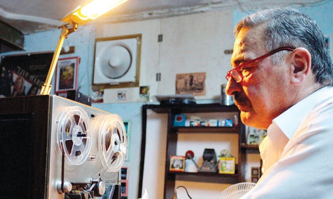 Abdel Qader Al-Ayoubi has scoured Iraq for old films and archive materials. (AFP)