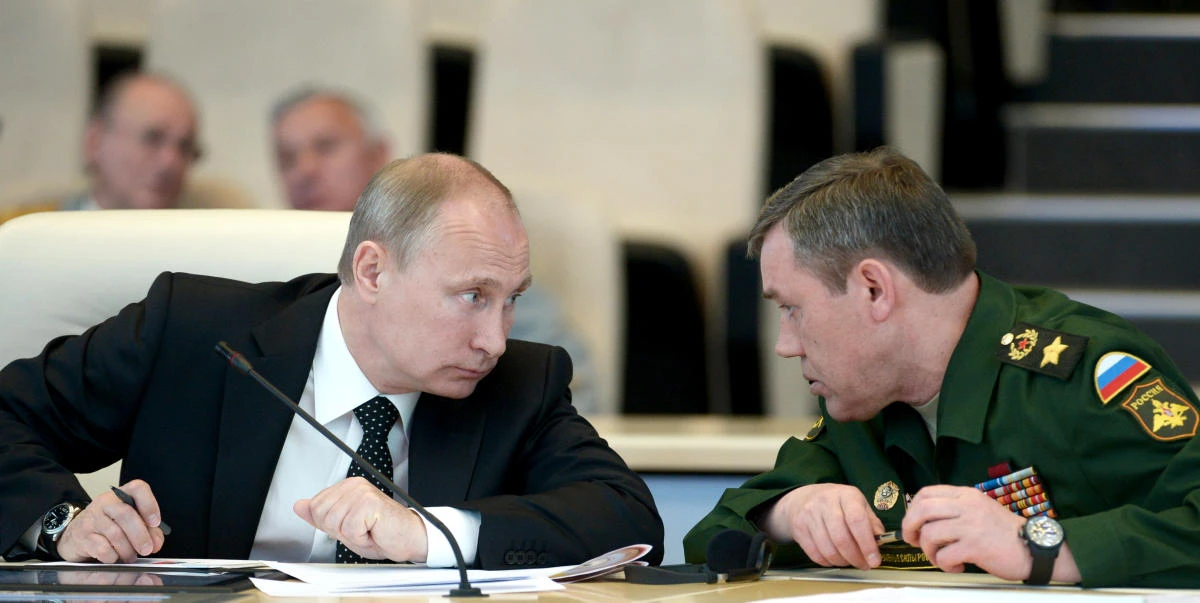 In this file photo, Russia’s President Vladimir Putin confers with chief of the Russian military’s General Staff Col. Gen. Valery Gerasimov. (AFP)