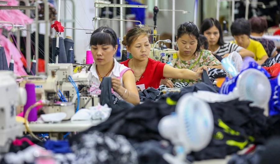 This photo taken on August 2, 2018 shows workers at a swimwear factory in Yinglin town in Jinjiang, in China's eastern Fujian Province. China's garments industry is expected to be affected with the escalating US-China trade war. (AFP photo)