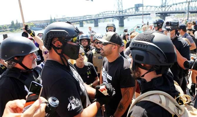 Right-wing rally organizer, Patriot Prayer founder and Republican Senate candidate Joey Gibson (C) speaks to supporters during a campaign rally for Gibson in Portland, Oregon, in this August 4, 2018 photo. (AFP)