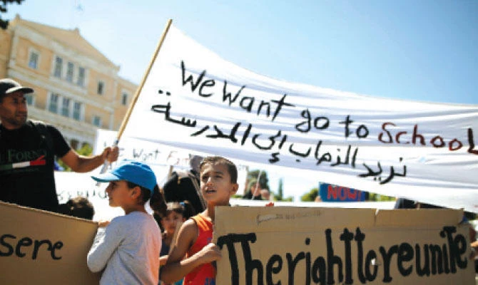 Syrian refugees demonstrate outside the German Embassy in Greece last year. The conflict in Syria has forced vast numbers out of education, and like others in Arab world, they are looking to overseas institutions.(Reuters)