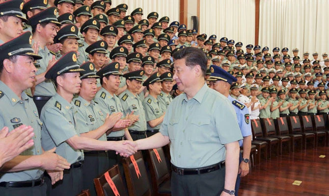 Chinese President Xi Jinping, also general secretary of the Communist Party of China (CPC) Central Committee and chairman of the Central Military Commission, meets with senior officers of Zhejiang Military Area Command during an inspection tour in east China's Zhejiang Province, in this May 26, 2015 file photo. (Xinhua/Li Gang)
