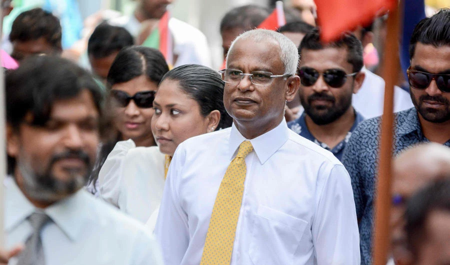 Maldivian opposition candidate Ibrahim Solih walks during a march to the Election Commission in Malé on July 26, 2018 to submit his application for president along with his running mate Faisal Naseem. (AFP / Ahmed Shurau)