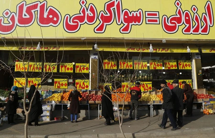 People buy fruits and vegetables in the Iranian capital Tehran. (AFP)