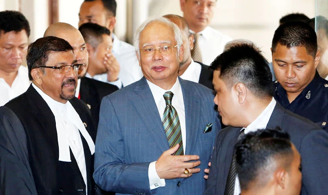 Malaysia's former prime minister Najib Razak walks out of a courtroom in Kuala Lumpur, Malaysia August 8, 2018. (REUTERS)