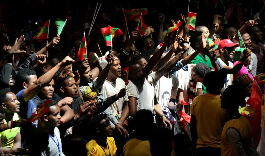 People hold Oromo Liberation Front (OLF) flags as they celebrate the returning of Jawar Mohammed, US-based Oromo activist and leader of the Oromo Protests, in Addis Ababa, Ethiopia, on August 5, 2018. (REUTERS/Tiksa Negeri)