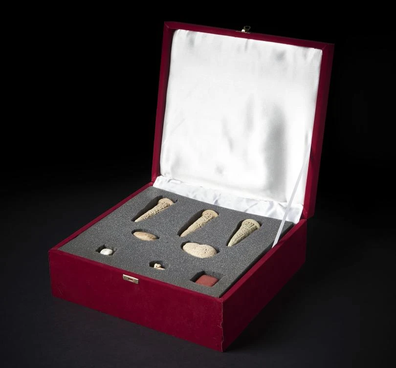 A handout picture released by the British Museum in London on August 9, 2018 shows a collection of looted antiquities, dating from between 2200BC to 3000BC, that were confiscated by British police in May 2003 and are provenenced to the ancient city of Girsu, now known as Tello, in southern Iraq. (AFP)