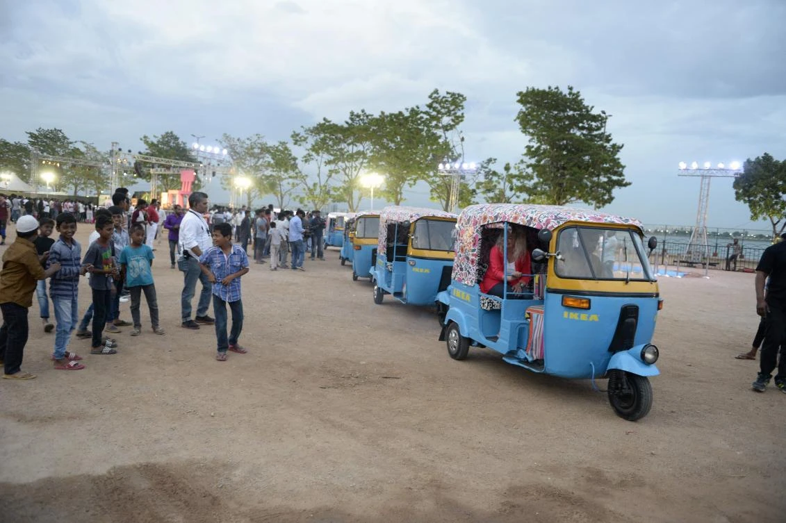 Ikea staff ride in auto rickshaws painted in Ikea colours at a promotional event for the new Ikea furniture store in Hyderabad. (AFP)