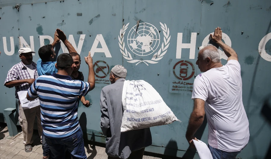UNRWA employees and their families protest against job cuts, in Gaza City. AFP