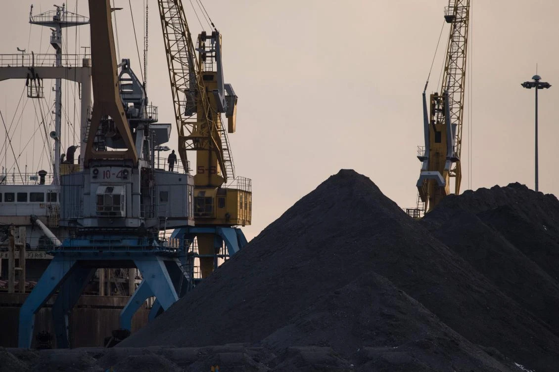 This file photo taken on November 21, 2017 shows a general view of North Korean coal piled up on a dockside at the port in Rason. (AFP)