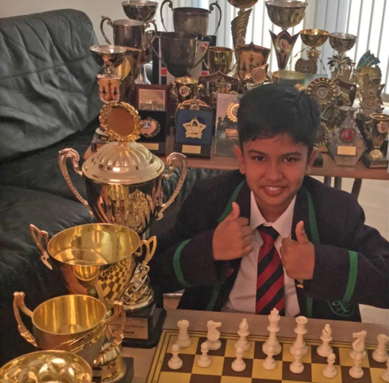 UK child prodigy Shreyas Royal and the numerous trophies he has won. (Courtesy of Facebook)