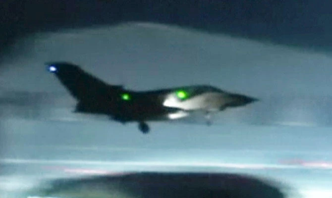 This image made from video shows a fighter jet landing at Akrotiri military British Royal Air Force Base, Cyprus, Saturday, April 14, 2018. (AP)