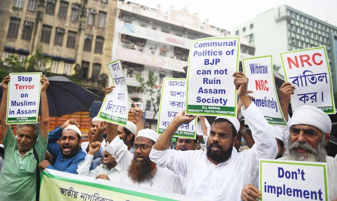 Activists of the Minority Youth Federation shout slogans against the Bharatiya Janata Party (BJP) lead central and Assam state government during a protest rally following the publishing of the first complete draft of the National Register of Citizens (NRC), in Kolkata on July 31, 2018. (AFP)