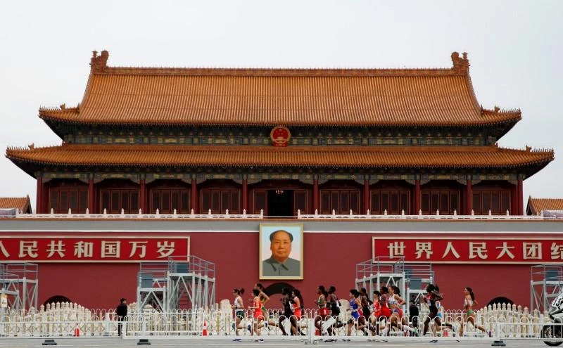 A huge portrait of Mao Zedong hangs over the entrance to the Forbidden City, a closed network of nearly 1,000 buildings from which China was remotely ruled for close to 500 years. (Reuters)