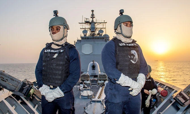 US Navy sailors stand watch on the fo'c'sle aboard the guided-missile cruiser USS Princeton as it transits the Strait of Hormuz October 22, 2017. (REUTERS)