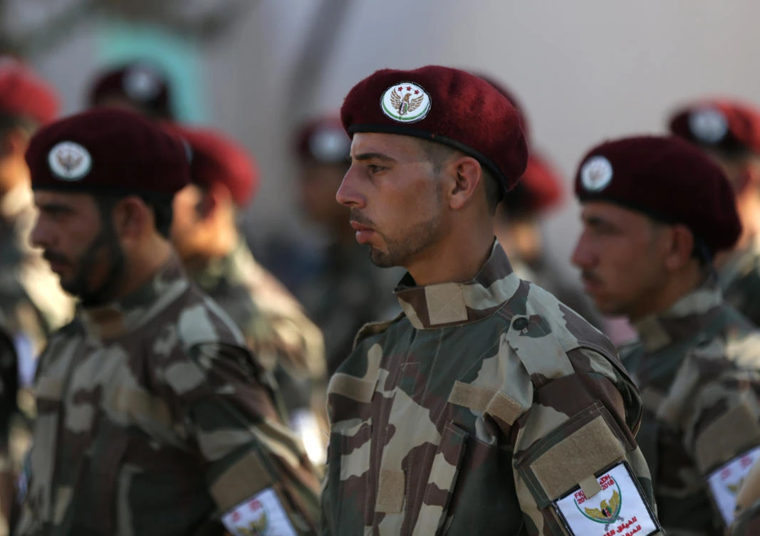 Fighters of National Army, backed by Turkey, take part during a graduation ceremony in the city of Al-Bab, Syria Aug. 5, 2018. (Reuters/Khalil Ashawi)