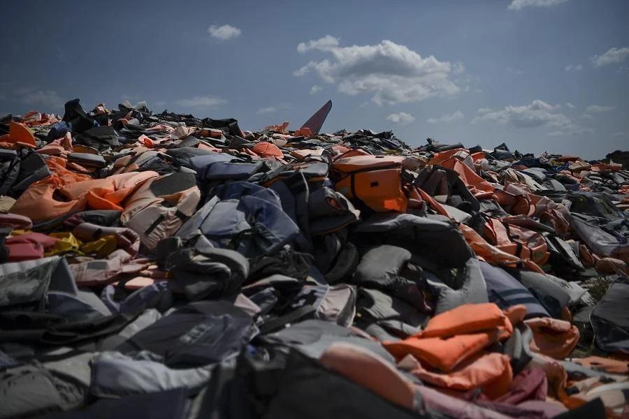 Thousands of life jackets used by refugees and migrants during their journey across the Aegean sea lie in a dump in Mithymna, on the Greek island of Lesbos on August 4, 2018. (AFP)