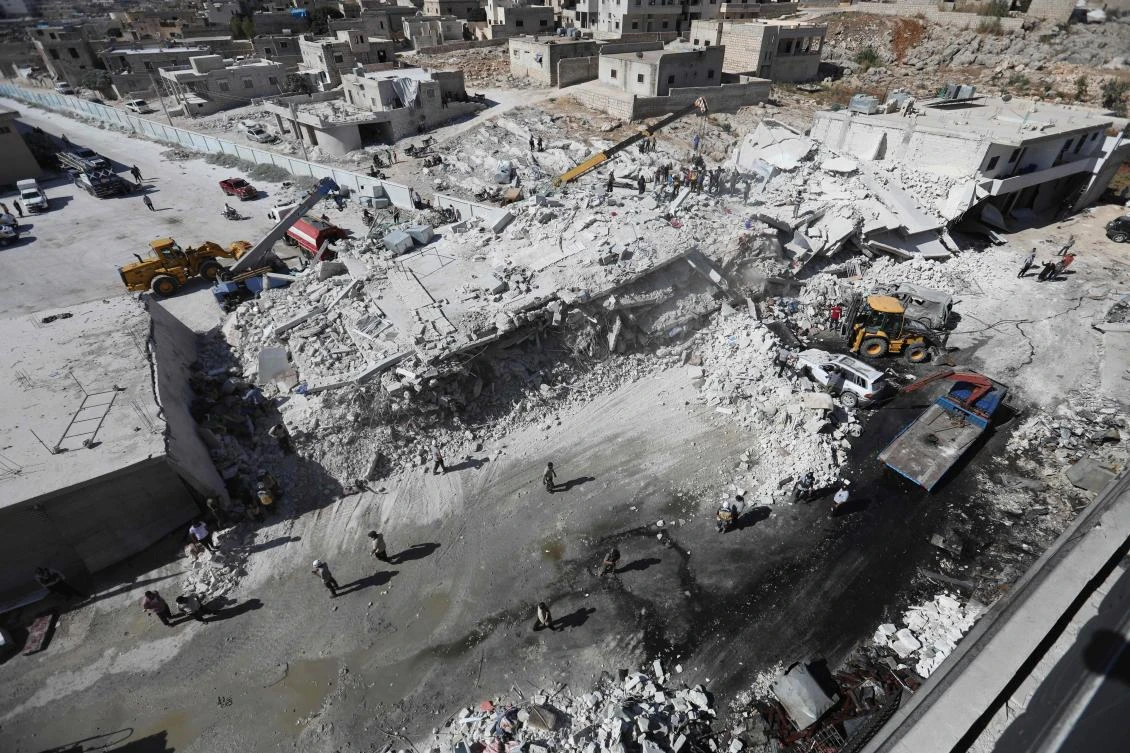 Destroyed buildings are seen on August 12, 2018 following an explosion at an arms depot in a residential area in Syria's northern Idlib province city of Sarmada in which 12 people were reportedly killed. (AFP)