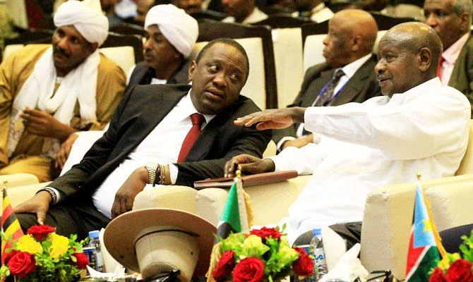 Uganda's President Yoweri Museveni talks to Kenya's President Uhuru Kenyatta as they attend the signing a cease fire and power sharing agreement between South Sudan's President Salva Kiir and South Sudanese rebel leader Riek Machar in Khartoum, Sudan, in this August 5, 2018 photo. (REUTERS)