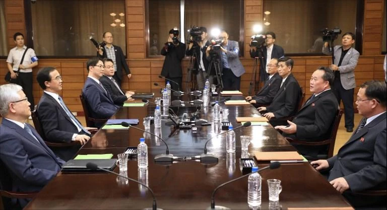 South Korean Unification Minister Cho Myoung-gyun, second left, speaks with his North Korean counterpart Ri Son Gwon, second right, during their meeting at the northern side of the border truce village of Panmunjom in the Demilitarized Zone. (AFP)
