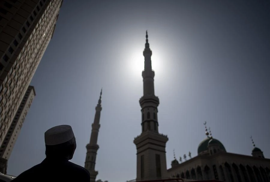 An ethnic Hui Muslim man standing in front of Laohuasi Mosque after Friday prayers in Linxia, China's Gansu province. (File photo: AFP)