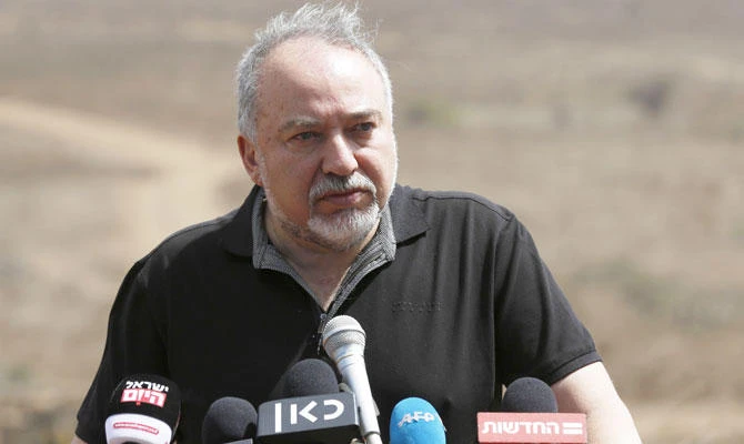 Israeli Defence Minister Avigdor Lieberman addresses the media during a visit to the Israel-Syria border in the annexed-Golan Heights, in this August 7, 2018 photo. (AFP)