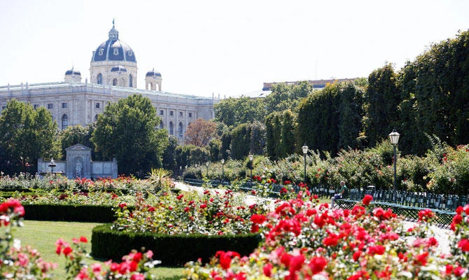 A woman rests in a public garden next to the Natural History Museum in Vienna, Austria, on Monday. (REUTERS)