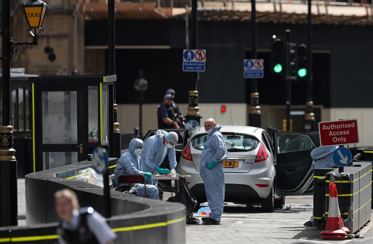 Forensic investigators work at the site after a car crashed outside the Houses of Parliament in Westminster, London, Britain, August 14, 2018. (Reuters)