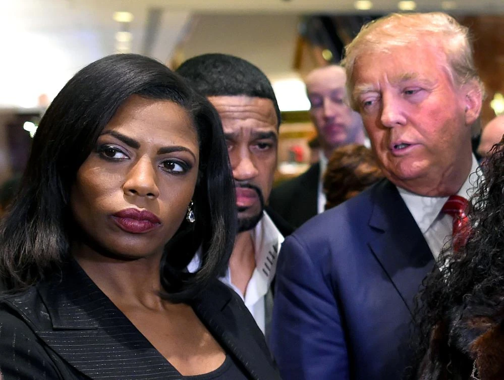 President Donald Trump lashed out at his former White House aide Omarosa Manigault Newman, left, slamming her as a ‘dog’ and ‘crazed’ as their mud-slinging match escalated. (AFP)